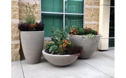 Large round outdoor concrete planters for sale available in multiple sizes