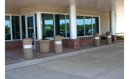 Concrete security bollard with built in lighting for sale in front of building